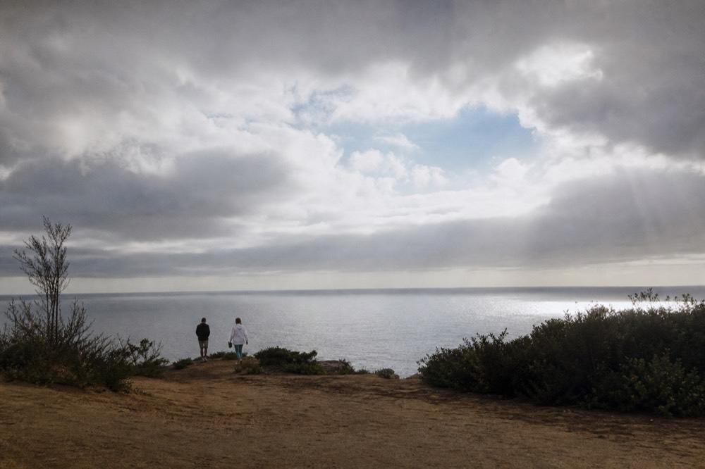 Low coastal clouds breaking apart over the Pacific near San Diego, no text, no logos, no people