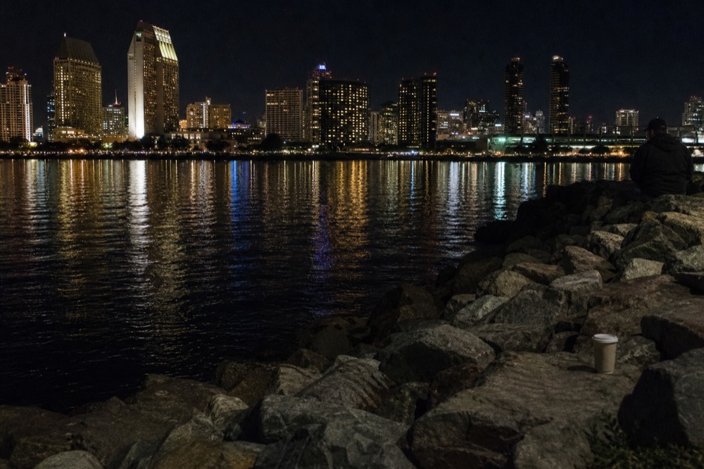 Downtown San Diego skyline at night seen across the bay water, no text, no logos, no people