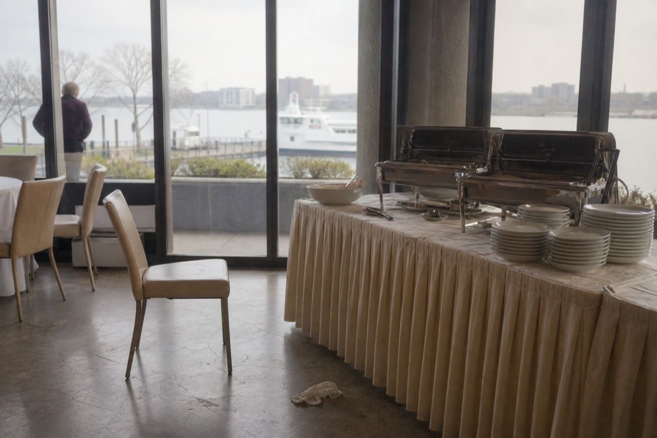 A brunch buffet table set beside a waterfront window in San Diego, no text, no logos, no people
