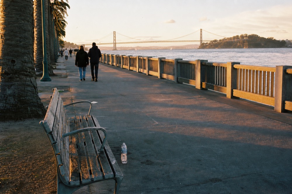 San Diego Embarcadero boardwalk along the bay at golden hour, no text, no logos, no people