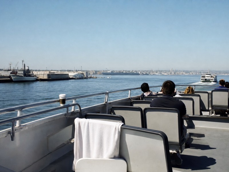 Open upper deck of a harbour tour boat on San Diego Bay in bright midday light