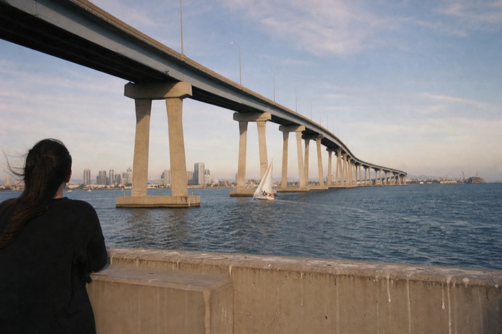 The Coronado Bridge curving over San Diego Bay with downtown towers beyond, no text, no logos, no people