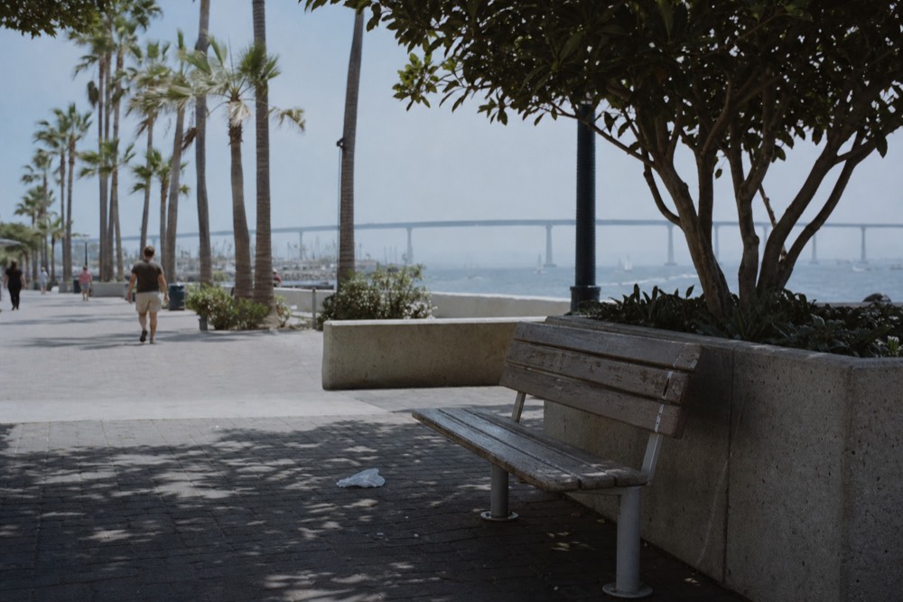 The Embarcadero bayfront path curving past the downtown skyline on a clear afternoon, no text, no logos, no people