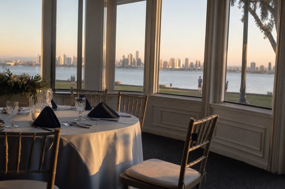 A set holiday dinner table with plates and glassware inside a cruise ship dining salon, no text, no logos, no people