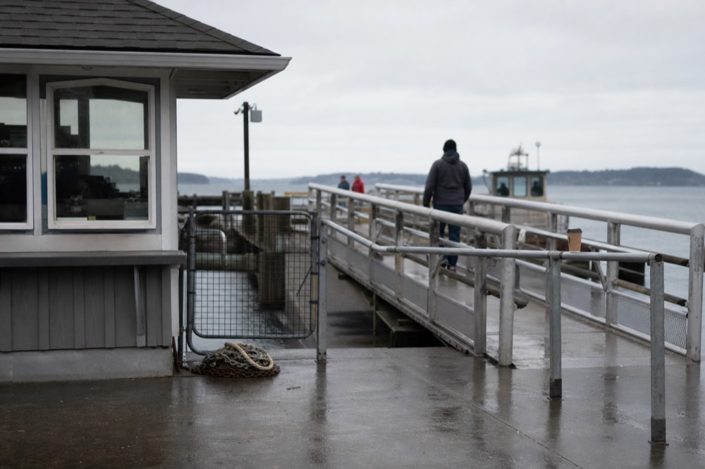 A ticket booth and boarding ramp at a San Diego Bay pier, no text, no logos, no people