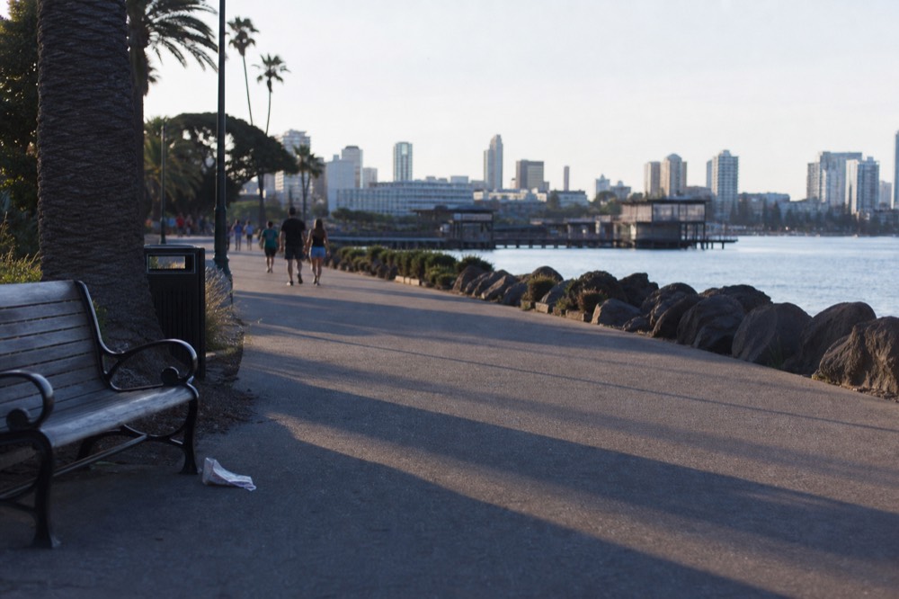 Embarcadero bayside walkway between Seaport Village and the downtown piers, no text, no logos, no people
