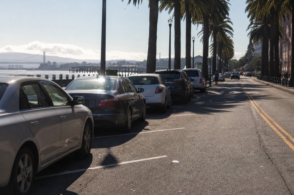 Waterfront parking area and palm-lined street near the San Diego Embarcadero, no text, no logos, no people