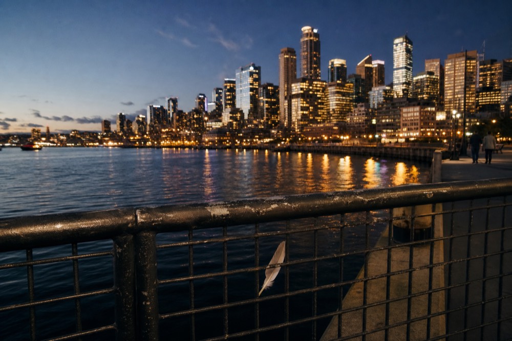San Diego skyline and bay front at night with illuminated buildings along the waterfront, no text, no logos, no people